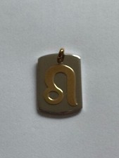 Ciondolo acciaio oro usato  Camaiore