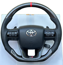 VOLANTE DE COURO PRETO FIBRA DE CARBONO GENUÍNO TOYOTA HILUX FORTUNER 2015-24, usado comprar usado  Enviando para Brazil