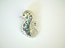 Pendentif paua abalone d'occasion  Bras