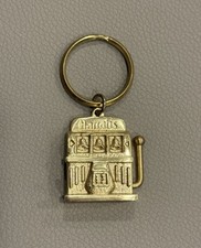 Chaveiro vintage Harrah's Casino latão máquina caça-níqueis lembrança colecionável comprar usado  Enviando para Brazil