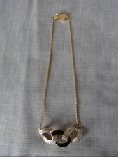 Collier métal doré d'occasion  Locminé