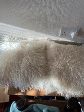 Two sheepskin cushions for sale  STANLEY