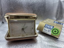 Relógio despertador de viagem vintage Elgin da década de 1950 com estojo -- corda e luminoso  comprar usado  Enviando para Brazil