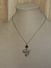 Collier argenté visage d'occasion  Gargenville