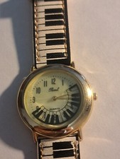 Relógio vintage Pearl Piano nota musical animação comprar usado  Enviando para Brazil