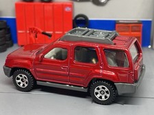 SUV Nissan Xterra marrom 2000-2004 escala 1/64 comprar usado  Enviando para Brazil