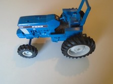 Trator azul fundido ERTL Ford 7710 vintage sem pilha de fumaça fazenda 4x4 agricultor comprar usado  Enviando para Brazil