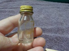 VINTAGE MINIATURA FRASCO DE VIDRO TRANSPARENTE 2 POLEGADAS TAMPA DE METAL FABRICANTES MARCA H SOBRE UM A comprar usado  Enviando para Brazil