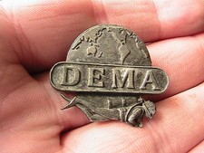 Dema pin badge for sale  BOLTON