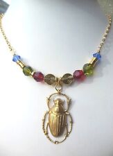 Collier scarabée doré d'occasion  Sourdun