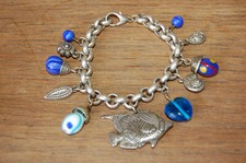 Magnifique bracelet breloques d'occasion  La Côte-Saint-André