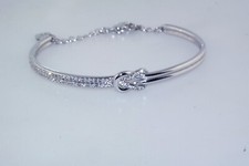 Pulseira Swarovski logotipo cisne cristal tom prata bypass nó punho bracelete comprar usado  Enviando para Brazil