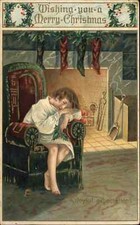 Cartão postal vintage de Natal criança dormindo na cadeira pelo fogo esperando pelo Papai Noel c1910 comprar usado  Enviando para Brazil