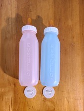 Lote de 2 mamadeiras de plástico vintage Evenflo Pyramid com tampas rosa e azul pastel 8 oz comprar usado  Enviando para Brazil