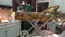 Carrinho de bebê vintage com moldura de metal corpo de vinil dossel verde laranja floral anos 70, usado comprar usado  Enviando para Brazil