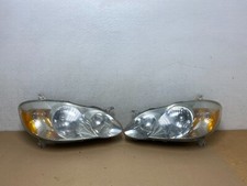2003 a 2004 Toyota Corolla conjunto de faróis laterais esquerdo+direito fabricante de equipamento original N2198 DW comprar usado  Enviando para Brazil
