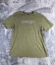Camiseta gráfica Y2K Oakley 2XL verde oliva logotipo geométrico ajuste regular skate surf comprar usado  Enviando para Brazil