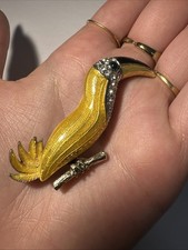 Broche toucan dorée d'occasion  Andernos-les-Bains