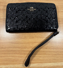 Cartera de teléfono Coach para mujer en charol grabado negro segunda mano  Embacar hacia Argentina