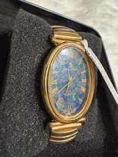 Relógio Designtime feminino ouro e opala pulseira de algarismos romanos usado precisa de bateria comprar usado  Enviando para Brazil