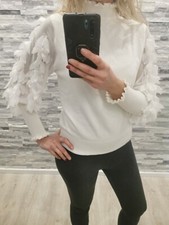Maglia bianca con usato  Momo
