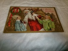 Cartão postal antigo de Papai Noel em relevo de 1910 com Papai Noel, brinquedos e crianças comprar usado  Enviando para Brazil