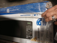 GCST20S1WSS GE® 2.0 Cu. Forno de micro-ondas de bancada com capacidade de pés CAIXA ABERTA inoxidável comprar usado  Enviando para Brazil