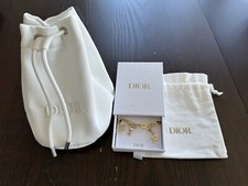 Dije de teléfono dorado Dior y bolsa con cordón cosmético blanco conjunto de regalo segunda mano  Embacar hacia Mexico