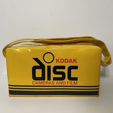 Câmera de disco Kodak e bolsa de transporte de filme amarela/preta/vermelha acolchoada isolada vintage comprar usado  Enviando para Brazil