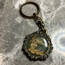 Chaveiro dividido Michael Negrin bronze aparência vintage cisnes e amantes anúncios de negócios comprar usado  Enviando para Brazil