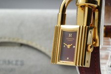 [Perto de ESTADO PERFEITO/CAIXA] Hermes Kelly relógio de quartzo feminino mostrador vermelho vinho do Japão comprar usado  Enviando para Brazil