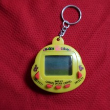 Usado, Raro Tamagotchi Dinkie Dino 26 em 1 animal de estimação virtual anos 90 brinquedo eletrônico digital para animais de estimação comprar usado  Enviando para Brazil