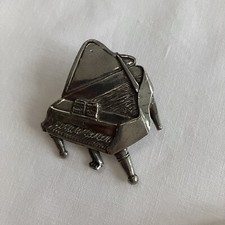 Broche argenté piano d'occasion  Expédié en Belgium