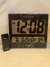 Sharp atomic clock d'occasion  Expédié en Belgium