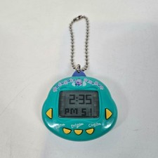 Vintage Rakuraku Dinokun Japonês Virtual Pet Verde Aqua e Amarelo Dinkie Dino comprar usado  Enviando para Brazil