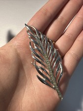 Broche plume argentée d'occasion  Andernos-les-Bains