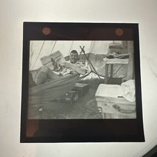 Antiga lanterna mágica Slide Scout Master deitado na rede na barraca com jornal comprar usado  Enviando para Brazil