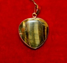 Pendentif oeil tigre d'occasion  Hauteville-Lompnes