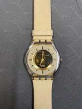 Relógio feminino Swatch Skin Thine 34 mm mostrador dourado estojo transparente redondo SFK155 fino comprar usado Relógio feminino Swatch Skin Thine 34 mm mostrador dourado estojo transparente redondo SFK155 fino comprar usado  Enviando para Brazil