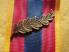 Agrafe palme bronze d'occasion  Conches-en-Ouche