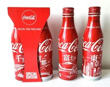 BOTELLAS DE ALUMINIO COCA COLA JAPÓN TOKIO/MT. FUJI/CHIBA& KYOTO CON PERCHA DE PAQUETE segunda mano  Embacar hacia Mexico
