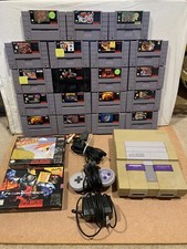 Sistema de entretenimiento Super Nintendo (consola SNES) paquete con 20 juegos y libros segunda mano  Embacar hacia Mexico