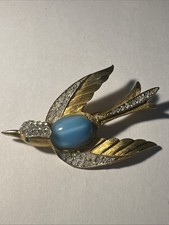 Broche oiseau dorée d'occasion  Andernos-les-Bains