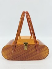 Bolsa de mão vintage 1950s baquelite marrom caramelo listrada parte superior esculpida reversa comprar usado Bolsa de mão vintage 1950s baquelite marrom caramelo listrada parte superior esculpida reversa comprar usado  Enviando para Brazil
