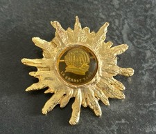 Superbe broche soleil d'occasion Superbe broche soleil d'occasion  France