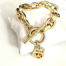 Usado, Pulseira de elos em tom dourado Michael Kors fecho alternado cadeado “MK link” logotipo MK comprar usado  Enviando para Brazil