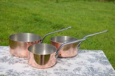 Three copper pans d'occasion  France