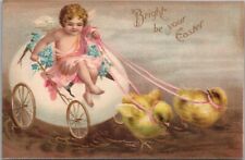 Tarjeta postal vintage de Pascua en relieve querubín ángel en carro de huevos / pollitos bebé - 1908 segunda mano  Embacar hacia Argentina