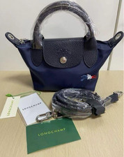 Longchamp pliage tres d'occasion  Expédié en Belgium