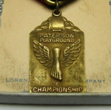 Medalhão antigo prêmio esportes pé alado PATERSON PLAYGROUND CHAMPIONSHIP comprar usado  Enviando para Brazil